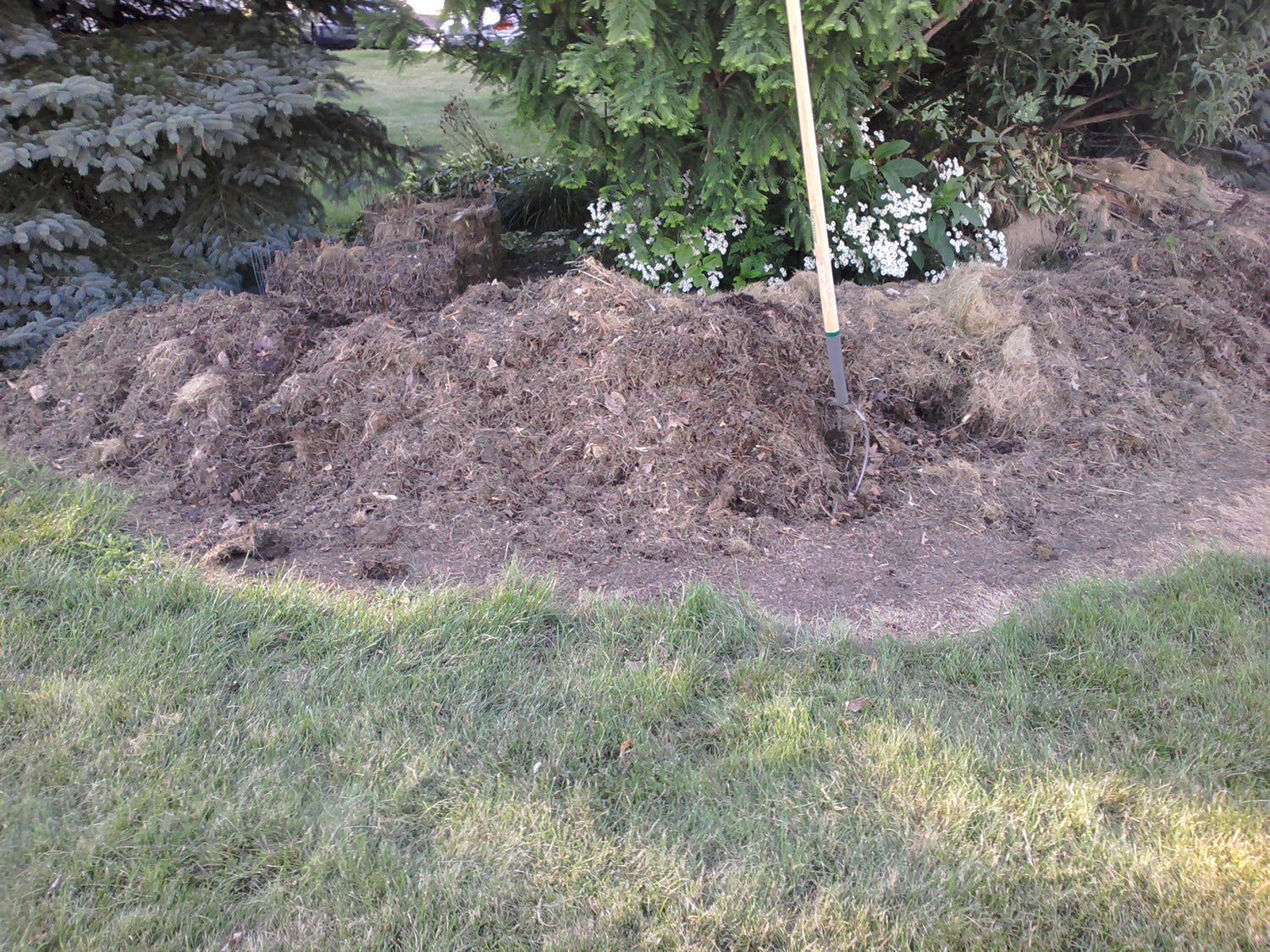 A residential compost pile being maintained